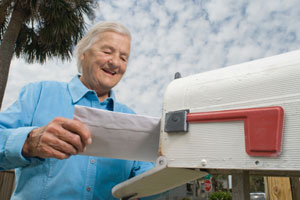 Elderly man speaking to a canadian pharmacy over the phone